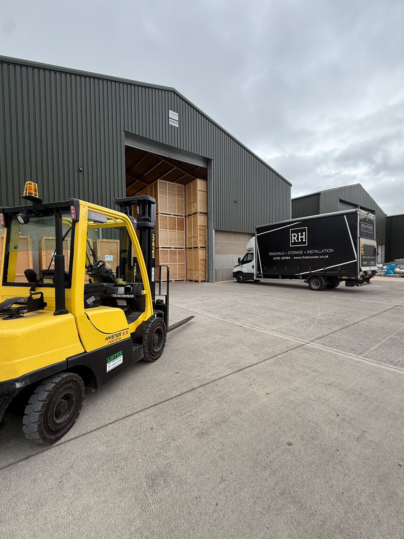 Forklift and RH lorry outside the RH storage warehouse