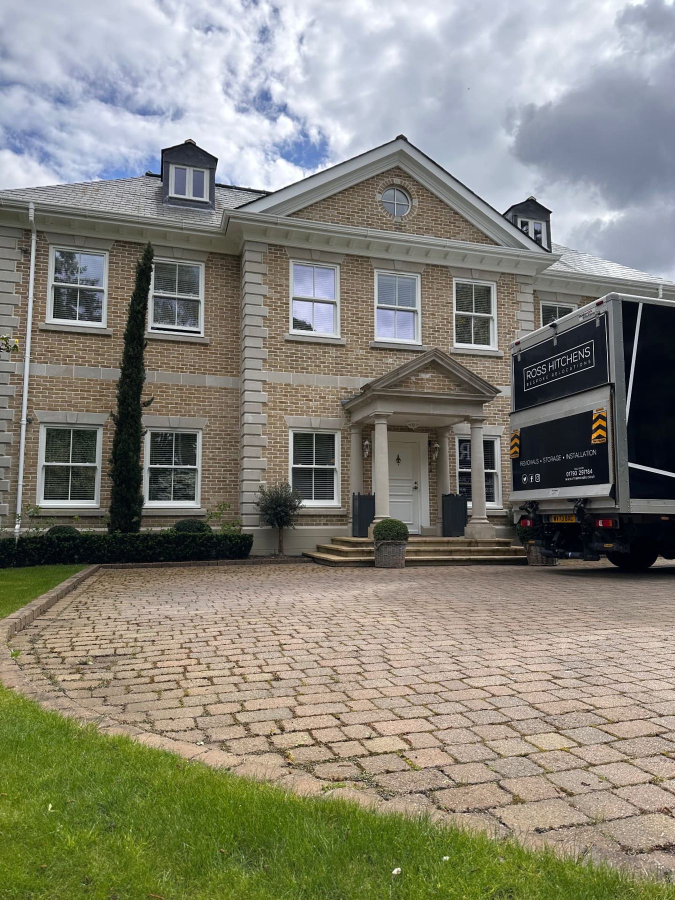 RH removal lorry outside a large country house