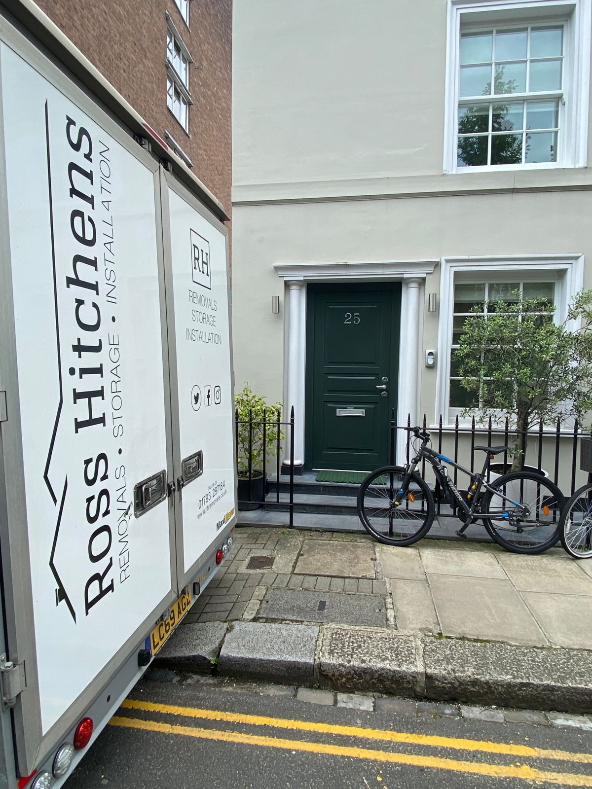 RH Removals vehicle outside a London townhouse