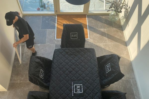 RH team fitting padded covers to furniture