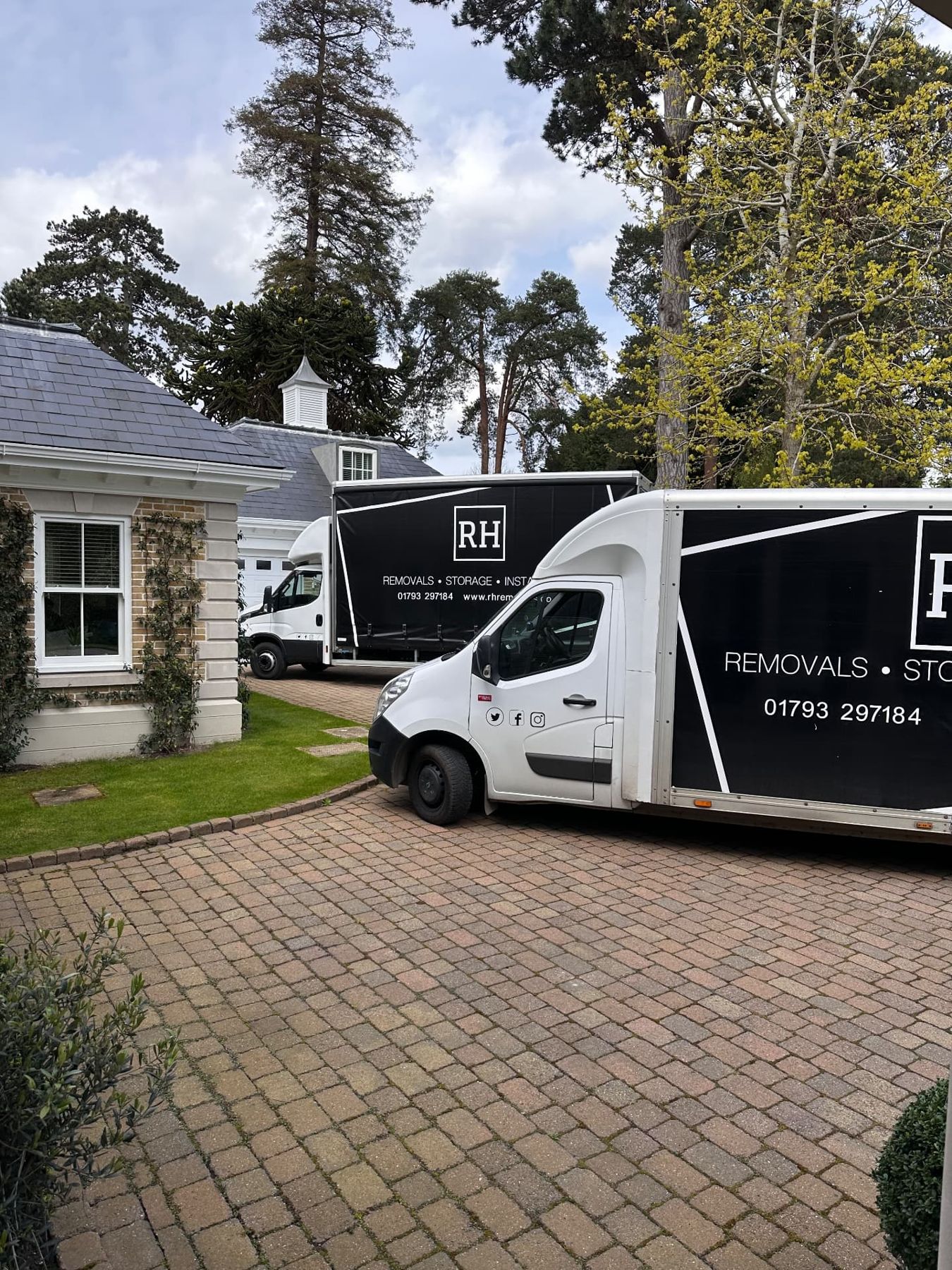 Two RH removal vehicles at a country property
